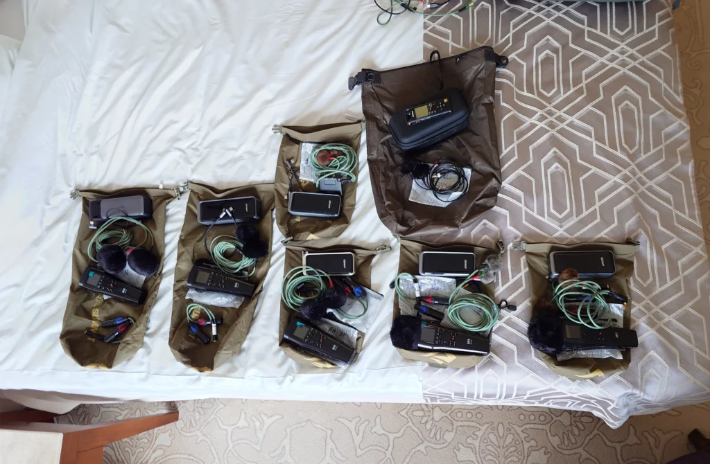 A set of various drop rigs kitted out and laying on a bed